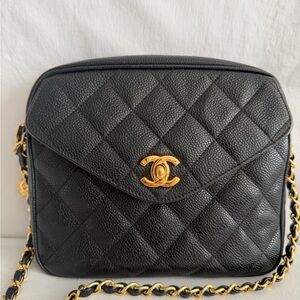 Chanel Black Quilted Crossbody Bag with 24 karat gold plated hardware.